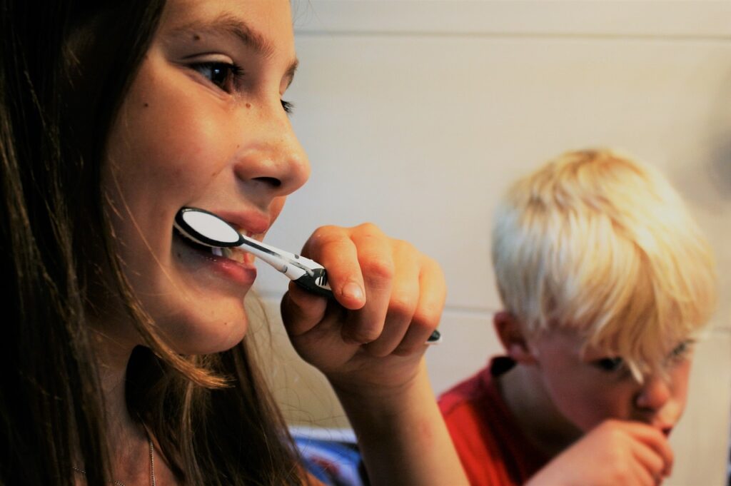 Mom and kid brushing teeth