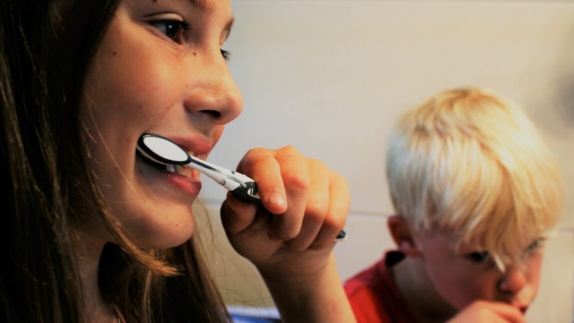 Mom and kid brushing teeth